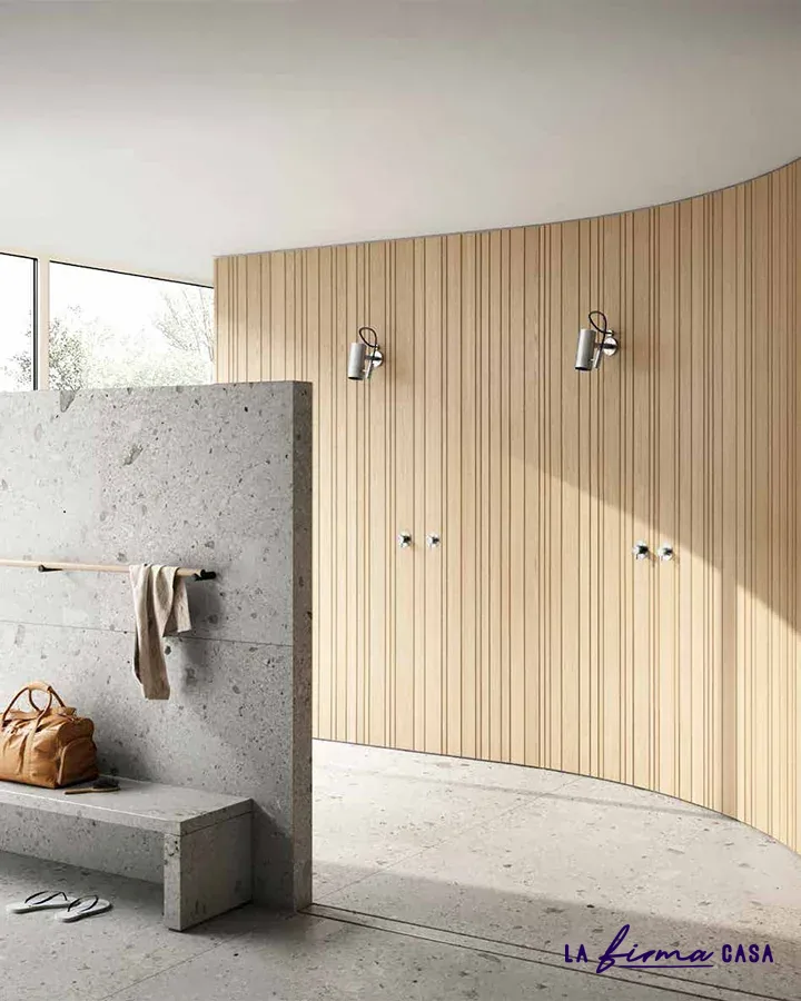 Curved wood slat wall with concrete bench by Aquaelite in Canada