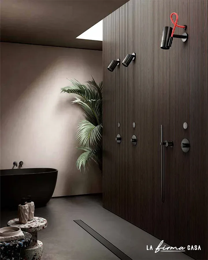 Dark slatted wall with black freestanding tub by Aquaelite in Canada