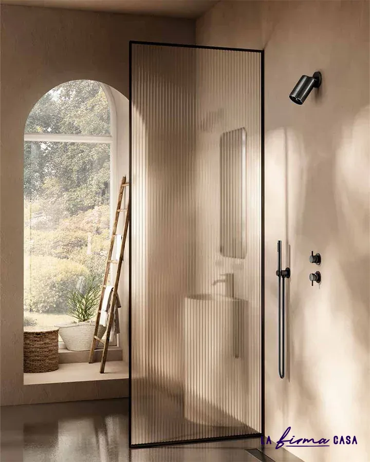 Fluted shower with black framed glass door by Aquaelite in Canada