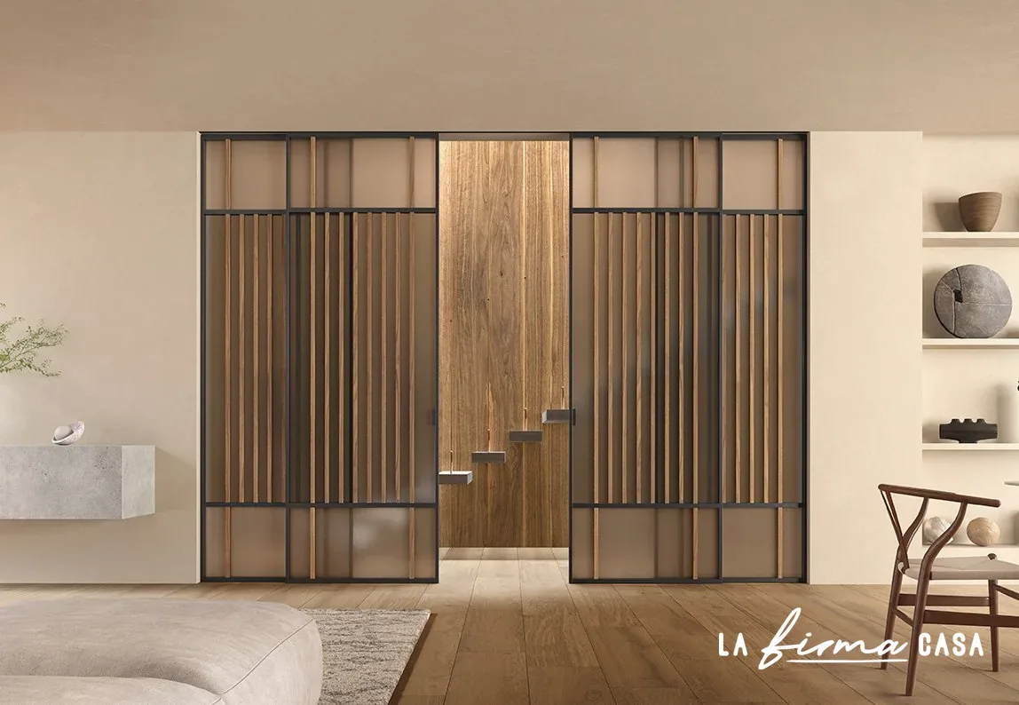 Crossbar sliding doors in a pale hallway by Barausse in Canada