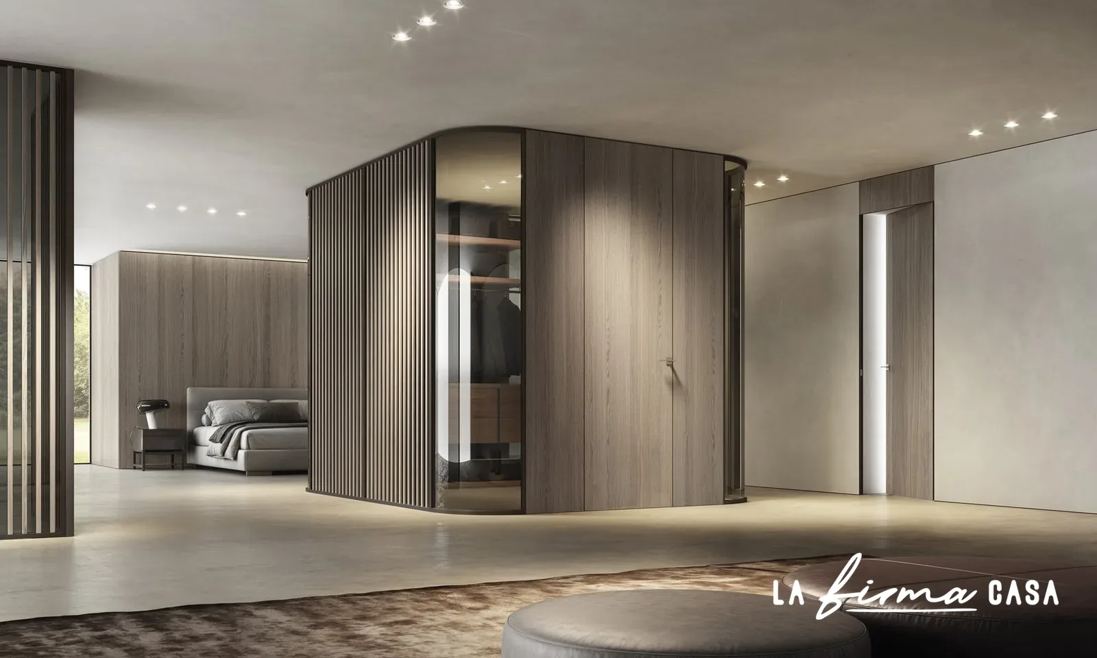 Curved walnut walk in wardrobe with mirror doors by Barausse in Canada