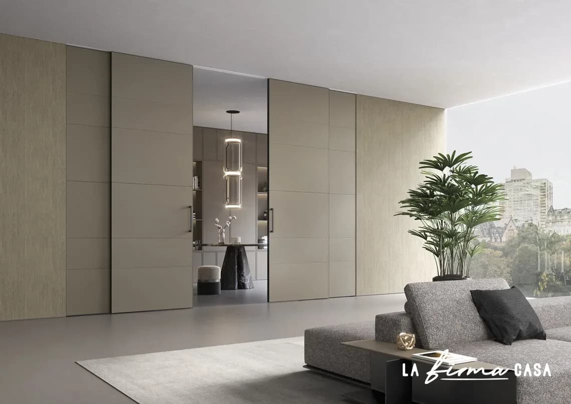 Leather clad sliding panels in a travertine lounge by Barausse in Canada
