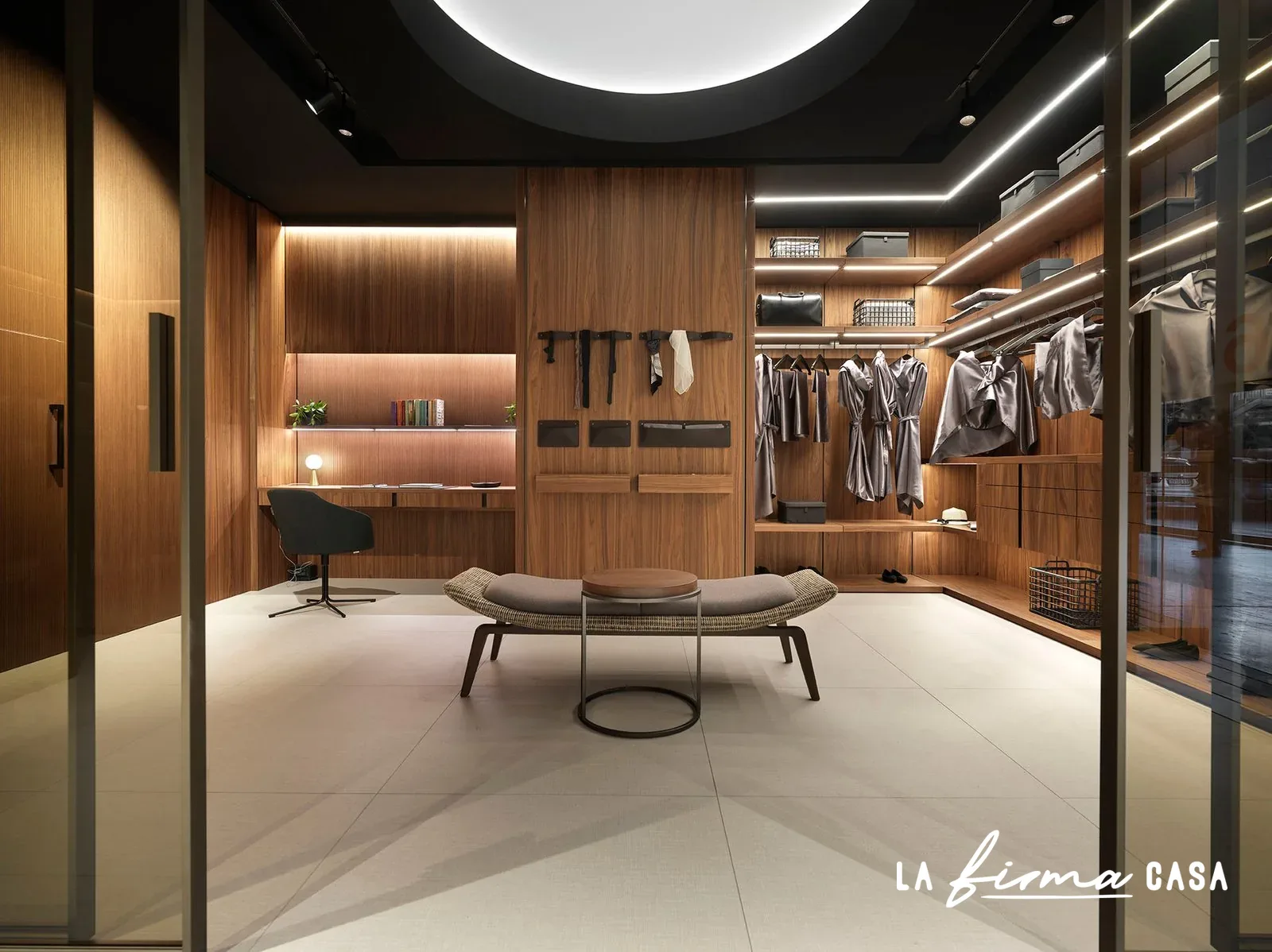Walk in closet pivot door with round ceiling light by Barausse in Canada