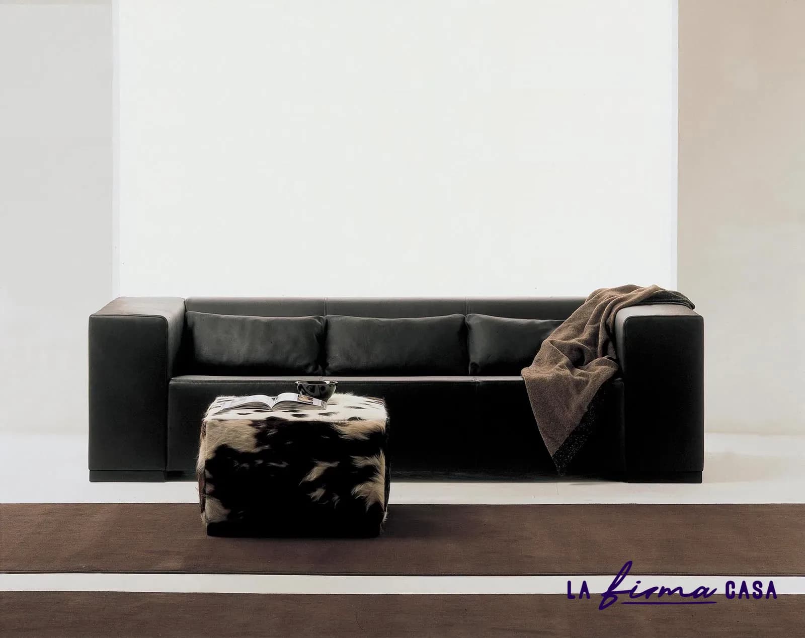 Black leather sofa with cowhide pouf by Gyform in Canada
