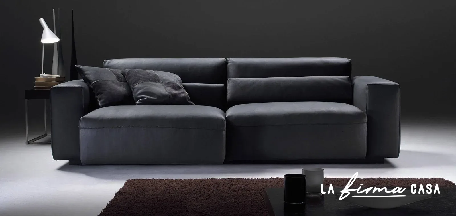 Black sofa with adjustable headrests by Gyform in Canada