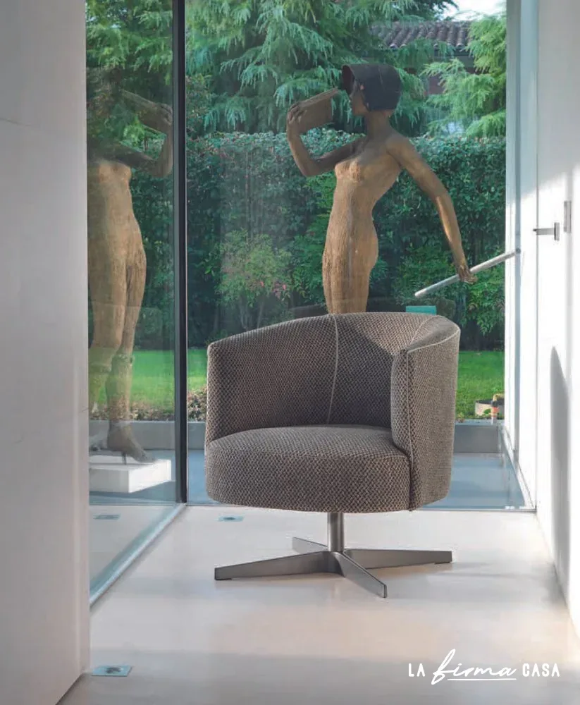 Brown swivel armchair by a sculpture garden by Gyform in Canada