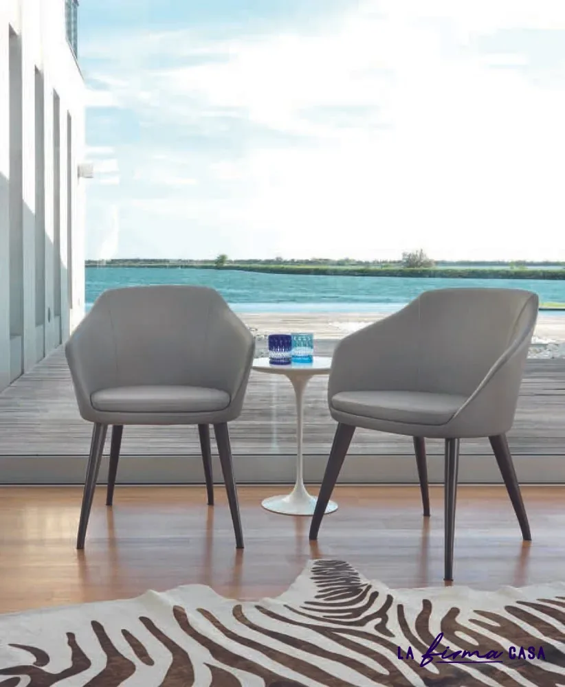 Grey armchairs with a side table on a terrace by Gyform in Canada