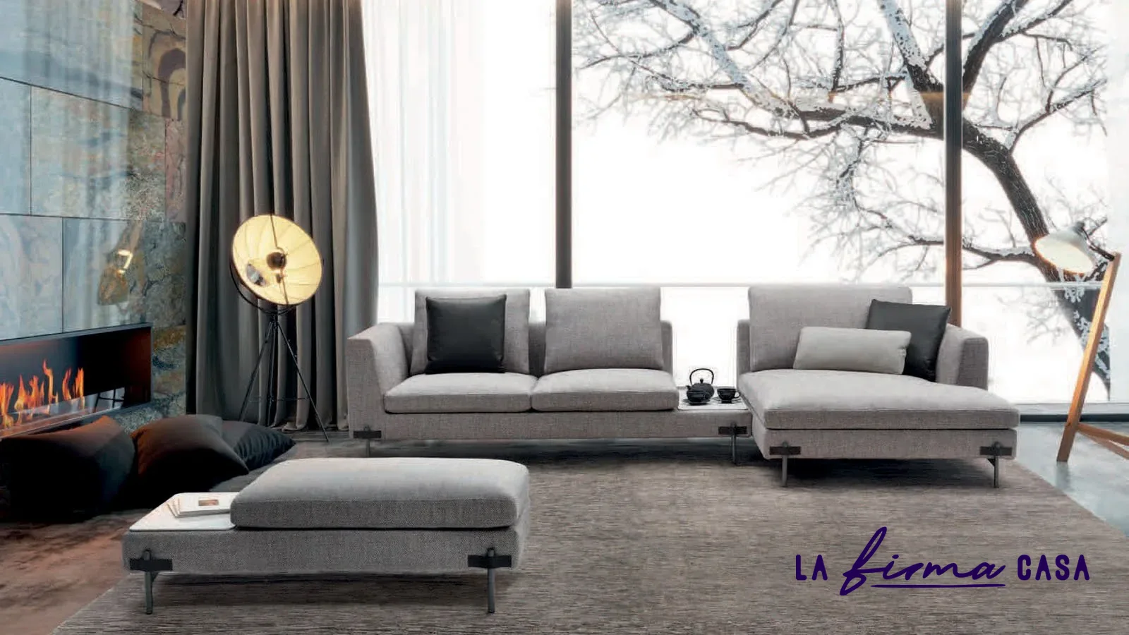 Grey sofa and ottoman by a fireplace by Gyform in Canada