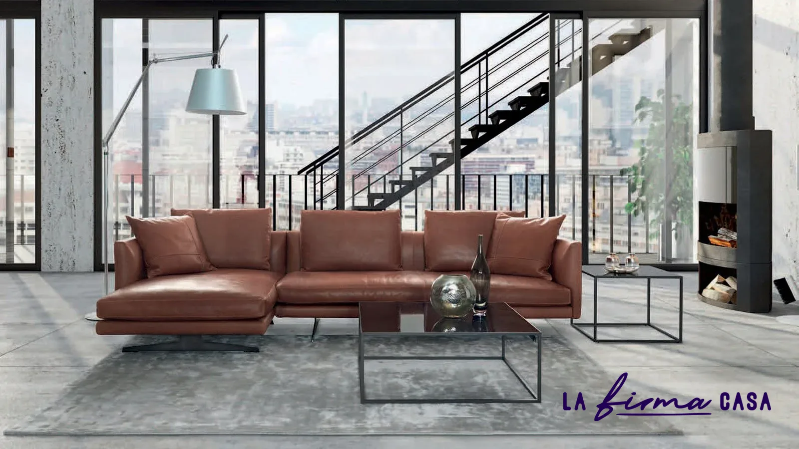 Tan leather sofa in a loft with city view by Gyform in Canada