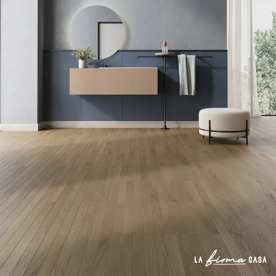 Light oak floor in a blue bathroom by Italiana Parquet in Canada