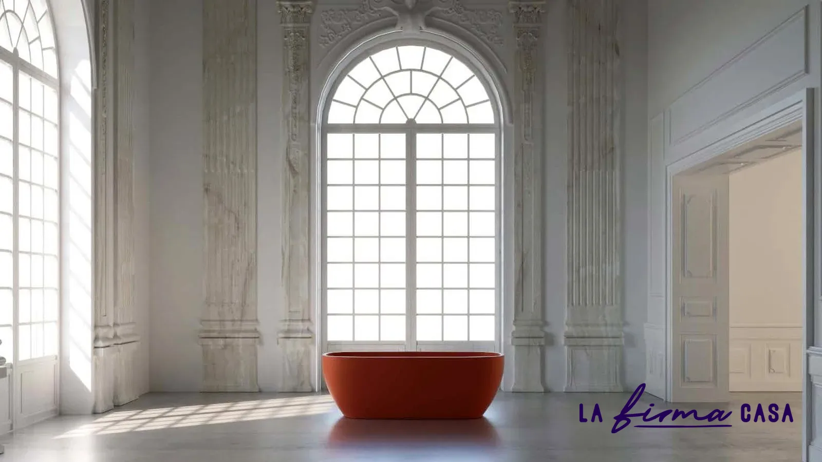 Terracotta freestanding bath in an arched stone hall by IW&W in Canada