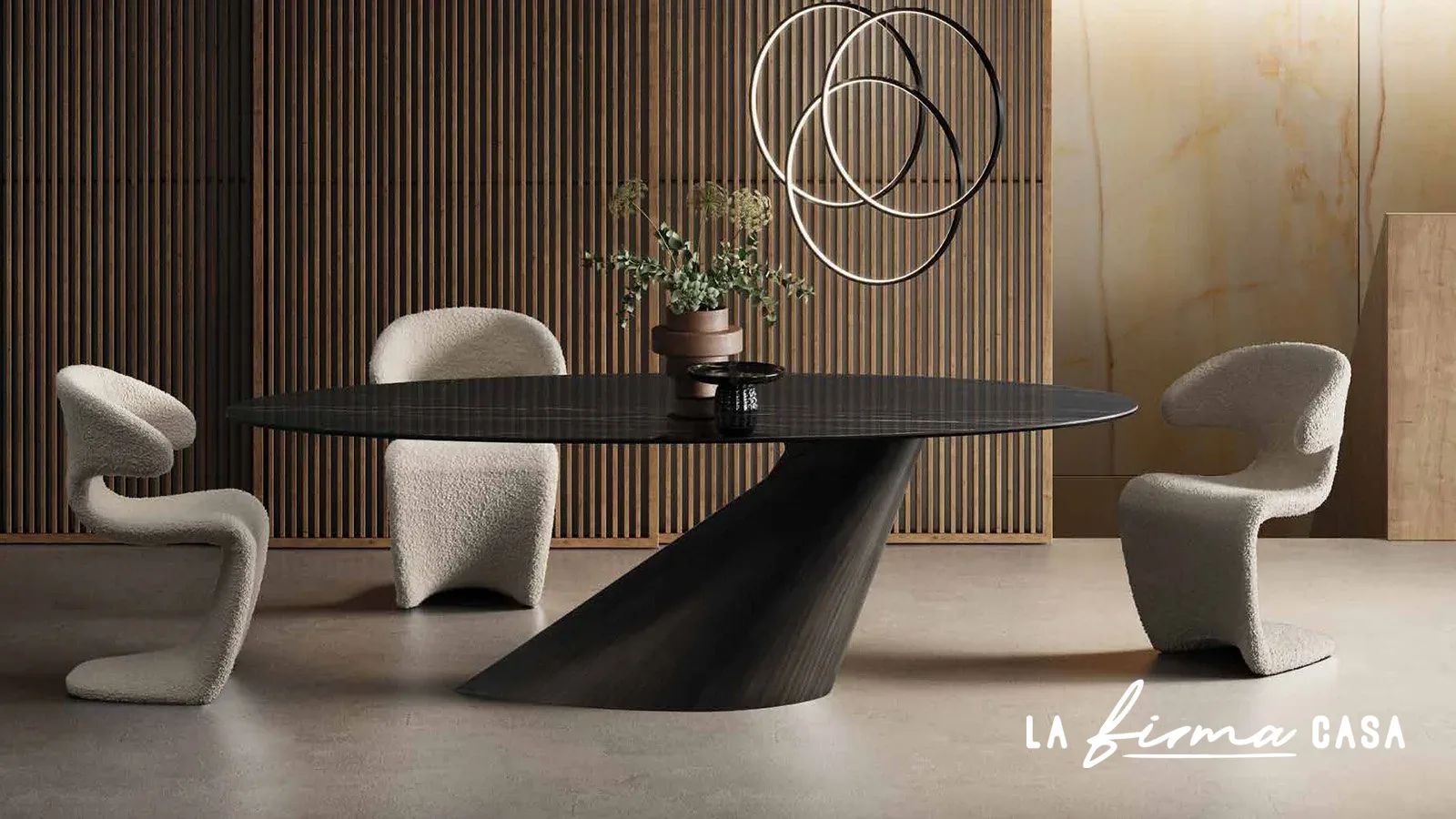 Black oval table on a folded sculptural base by Tafaruci in Canada