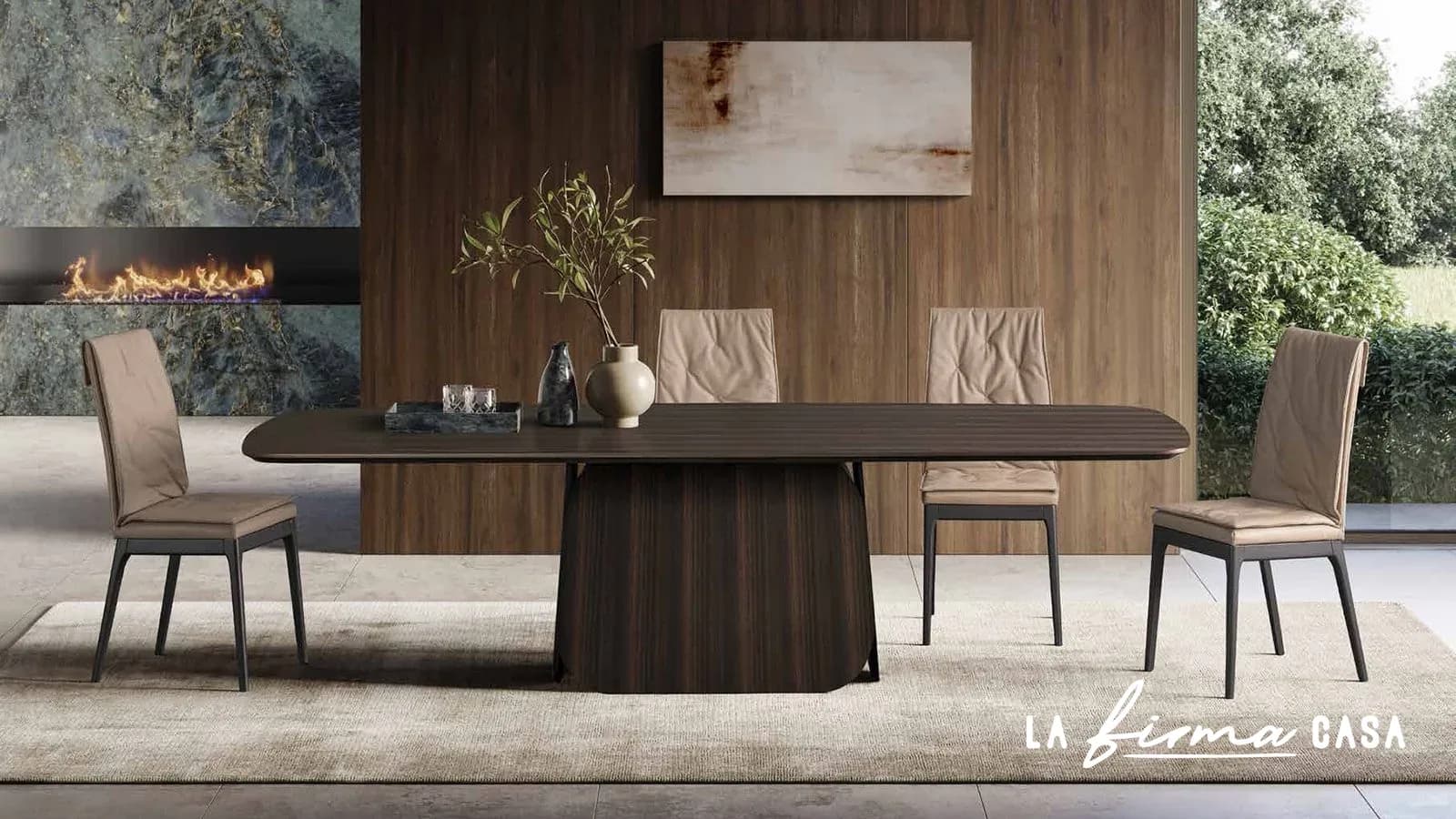 Dark table on a fluted pedestal by a fireplace by Tafaruci in Canada