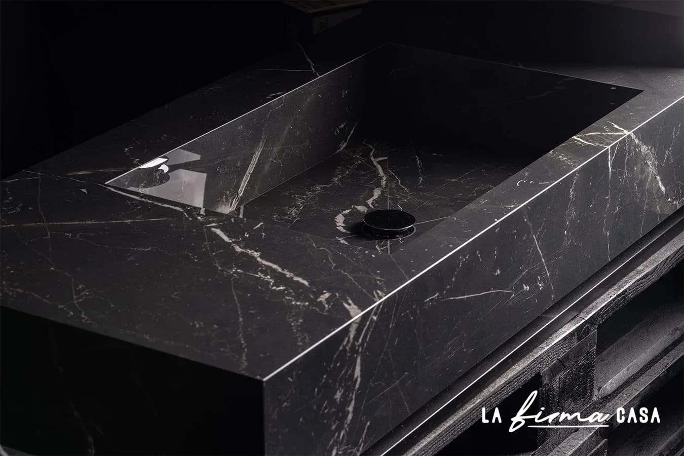 Black marble carved washbasin detail by TerzaDimensione in Canada
