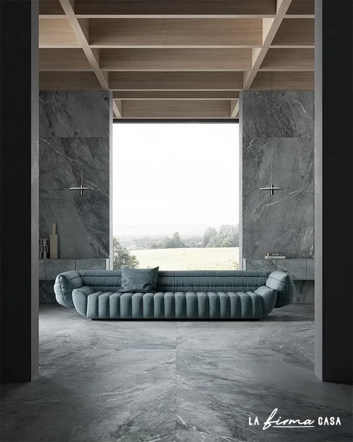 Grey stone bathroom with a green sofa by TerzaDimensione in Canada
