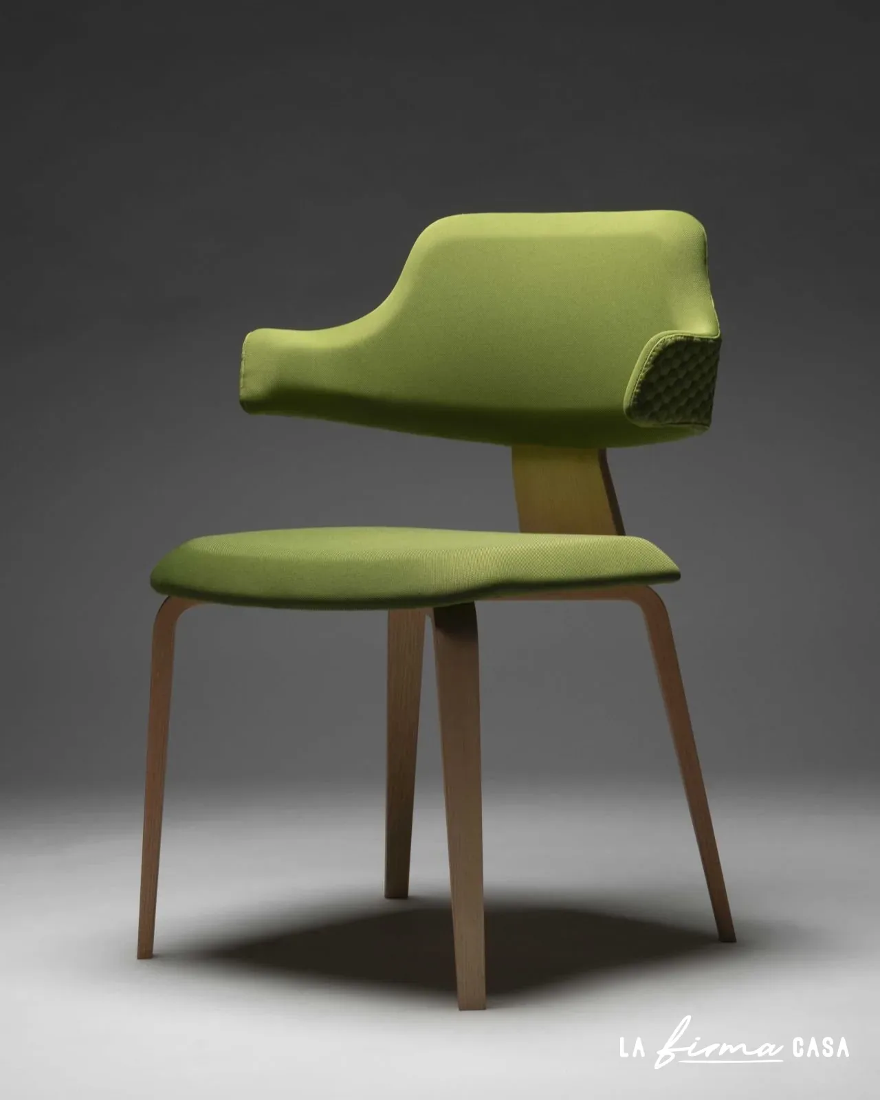 Olive green chair with wooden legs by Viganò Office in Canada