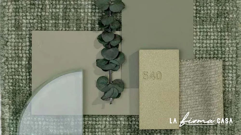 Green textile and eucalyptus material flatlay by Warli in Canada