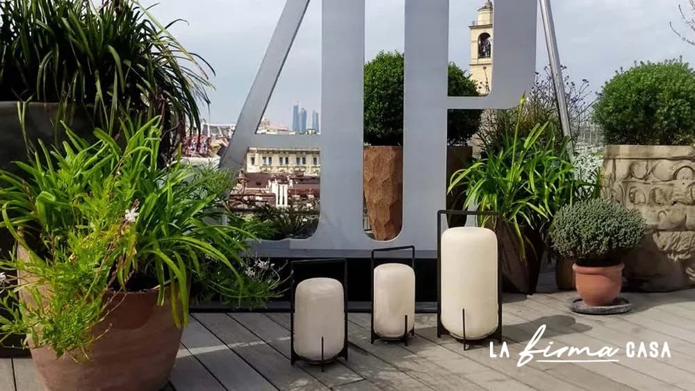Outdoor terrace rug with planters and stools by Warli in Canada