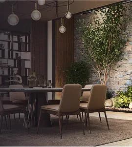 An elegant dining table with upholstered chairs beside a garden