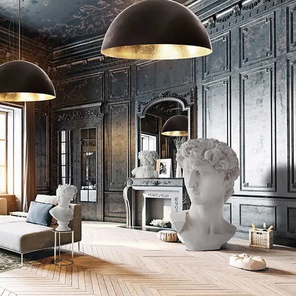 Adriani & Rossi interior with dark panelled walls, gold-lined dome pendant lights and a classical bust on a herringbone parquet floor
