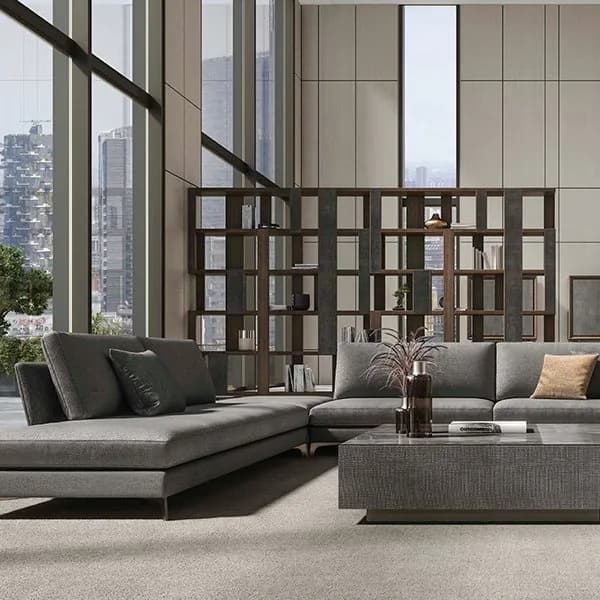 Ceppi srl living room with a grey sectional sofa, a textured coffee table and a wooden room divider