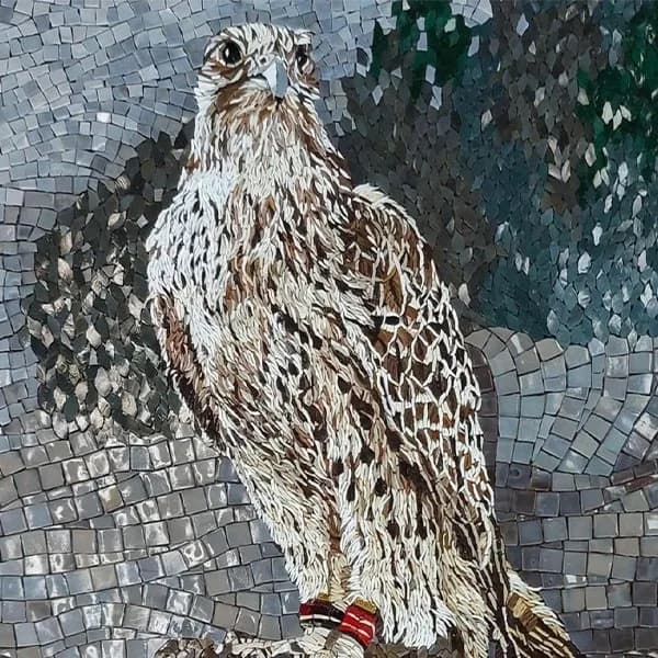 Tessere Mosaico artwork of a falcon rendered in white, brown and grey mosaic tesserae against a grey and green mosaic ground