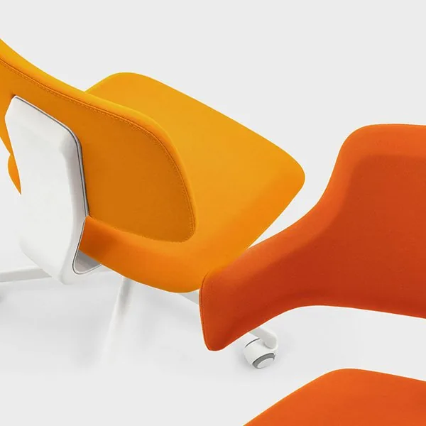 Viganò Office close-up of yellow and orange upholstered task chairs on white swivel bases with castors